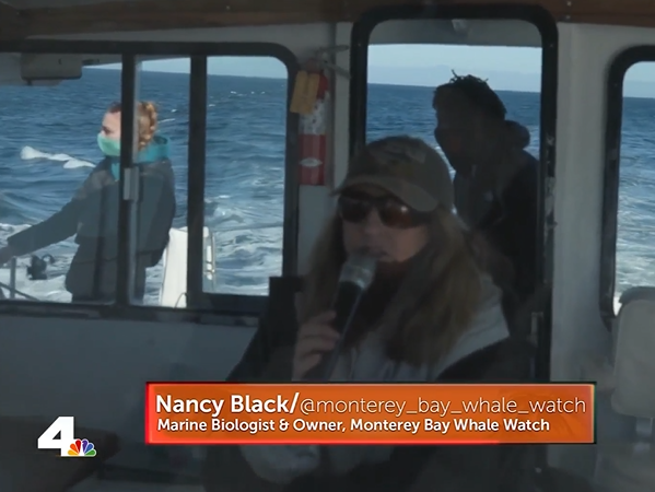 a man standing in front of a bus window